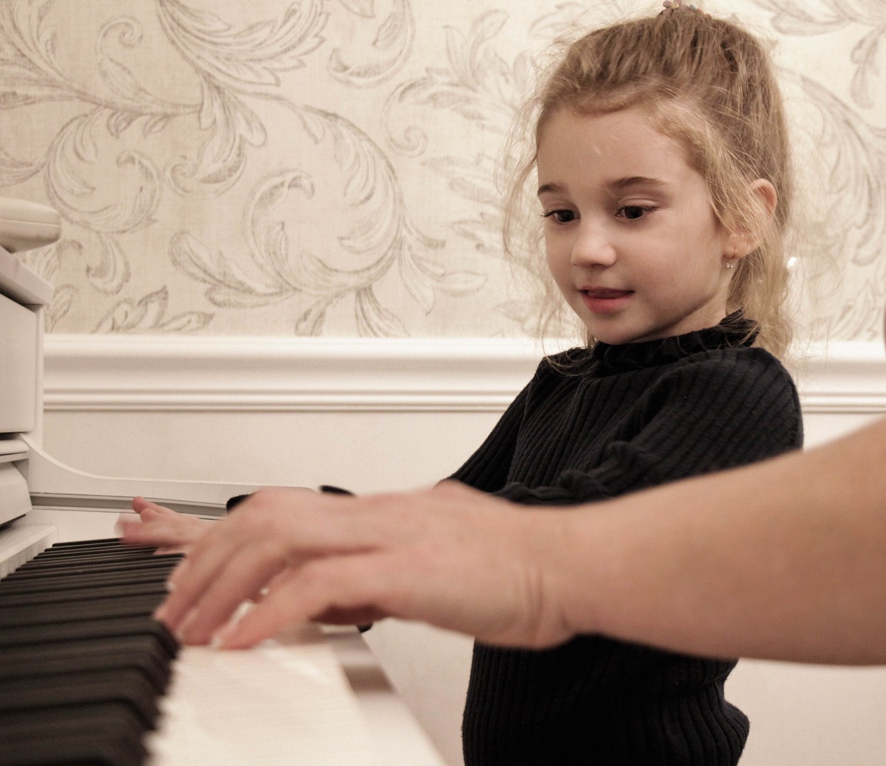 baby girl playing the piano